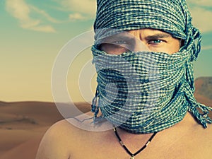 Brutal man in desert photo