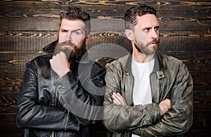 Brutal men wear leather jackets. Men brutal bearded hipster posing in fashionable black leather jackets. Leather fashion