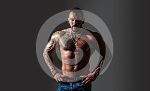 Brutal sportsman torso. steroids. sexy abs of tattoo man. male fashion. sport and fitness, health. confidence charisma
