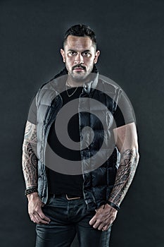 Brutal strict macho with tattoos. Masculinity and brutality. Tattoo brutal attribute. Tattoo culture concept. Man brutal