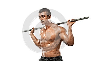 Brutal strong muscular bodybuilder athletic man pumping up muscles with barbell on white background. Workout