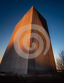 Brutalist Concrete Tower with Dramatic Shadows