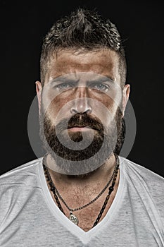 Brutality and masculinity. Man bearded hipster serious face close up. Brutal man with over suntanned skin face. Hipster