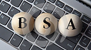 BSA - acronym on wooden balls on laptop keyboard background