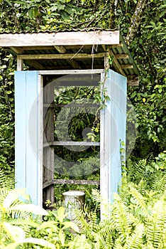 Bsckhouse, earth closet, restroom in the green of school on Island in New Guinea