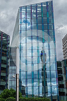 BT Tower reflected in Regent`s Place facade, London, Great Britain photo