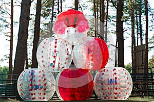 Bubble ball balloons on the green field. equipment for team building sport game named bumper ball or bubble ball
