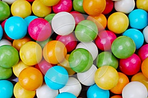 Bubble gum chewing gum texture. Rainbow multicolored gumballs chewing gums as background. Round sugar coated candy