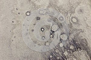 Bubble like pattern on sand beach background