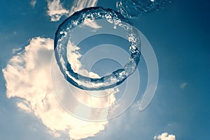 Bubble ring Underwater ascends towards the sun.