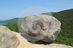 Bubble Rock on top of the South Bubble Mountain and Jordan Pond at Acadia National Park