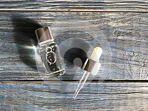 Bubble with serum and a dropper in the sunlight. cosmetics for care