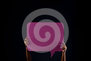 Bubble Speech Template Texture Background. Protest , Mob or Expression Concept. Person Raised Up a Blank Paper in the Dark