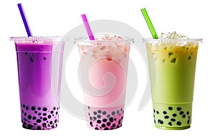 bubble tea glasses with pink, green and purple colored milk drinks, ice cubes and bubbles. cocktail