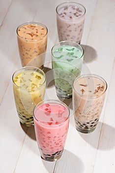 Bubble tea. Homemade Various Milk Tea with Pearls on wooden table.