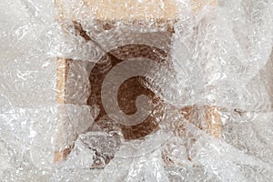 Bubble wrap on an open empty cardboard box. careful sending of a parcel