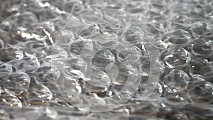 Bubble wrap close-up. Bubble wrap is a pliable transparent plastic material used for packing fragile items.