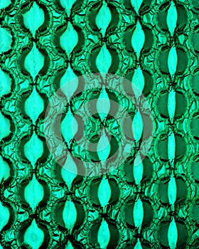 Bubble wrap in front of green paper.