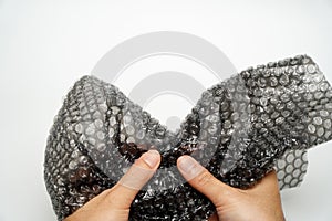 Bubble Wrap,Male hand popping bubbles of bubble wrap isolated on white background,anger management