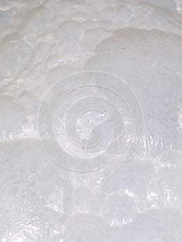 Bubbles background of boiling milk.