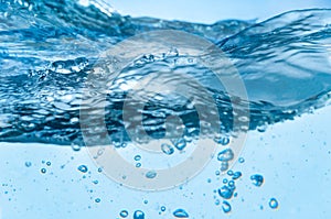Bubbles boiling in blue water