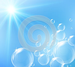 Bubbles floating in blue sky