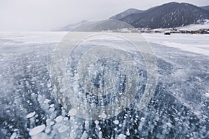 Bubbles in ice. Baikal lake. Winter landscape