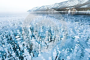 Bubbles of methane gas frozen into clear ice