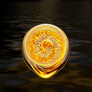 Bubbles oil inside a large oil bubble and golden flow on black