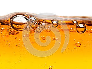 Bubbles in orange liquid soap