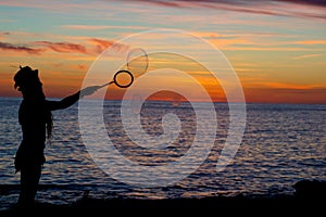 Bubbles silhouetted by the sunset of San Antonio Bay in Ibiza, Spain photo
