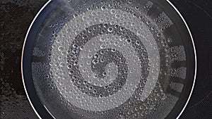 Bubbles of steam inside boiling water