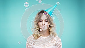 Bubbles, studio and face of woman at party celebration for festival, birthday or special event. Unsure facial expression