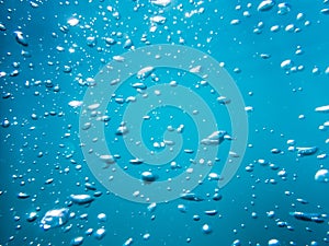 Bubbles underwater in ocean. Water texture in underwater