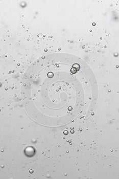 Bubbles in water on a white background. Closeup.