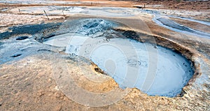 Bubbling geothermal hot/mud pool in the Hverarond area near Myvatn in the Icelandic landscape.