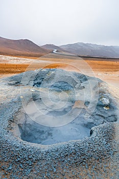 Bubbling geothermal hot/mud pool in the Hverarond area near Myvatn in the Icelandic landscape. photo
