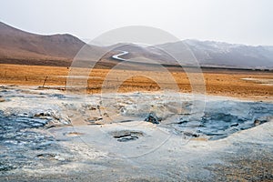 Bubbling geothermal hot/mud pool in the Hverarond area near Myvatn in the Icelandic landscape. photo