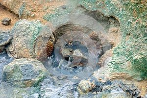 Bubbling hot pool in geothermal area