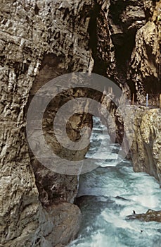 Bubbling Stream Flows through Eroded Rock at Partnachklamm Gorge in Bavaria, Germany