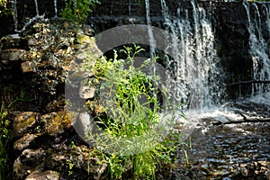 Bubbling water and stones. Cascade falls. Background texture