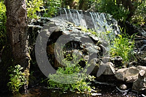 Bubbling water and stones. Cascade falls. Background texture