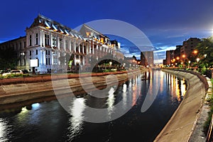 Bucharest courthouse at sundown looking over Dambovita river