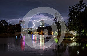 Bucharest heavy rain and thunder storm , lightning strike over the city, night cityscape