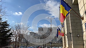 Bucharest, Robucharest, Romania Palace of the Parliament Boulevard full of trees to Parliament cars moving on empty road