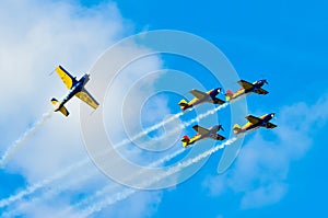 BUCHAREST, ROMANIA, 2015: Acrobatic planes at Bucharest International Air Show (BIAS) with blue sky background