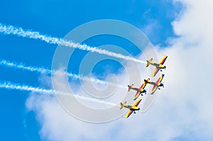 BUCHAREST, ROMANIA, 2015: Acrobatic planes at Bucharest International Air Show (BIAS) with blue sky background