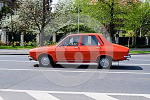 Bucharest, Romania, 24 April 2021 Old retro red Romanian Dacia 1300 classic car in traffic in a street in a sunny spring day