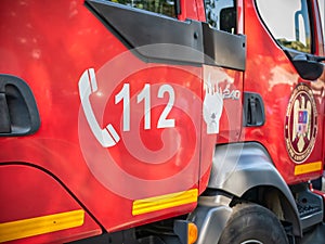 112 emergency number on a fire fighter car