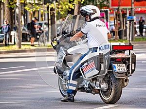 Traffic policeman on motorbike. Police officer control in the center of Bucharest